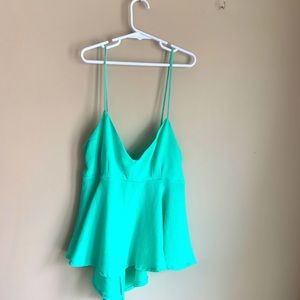 Bright blue flowy tank.